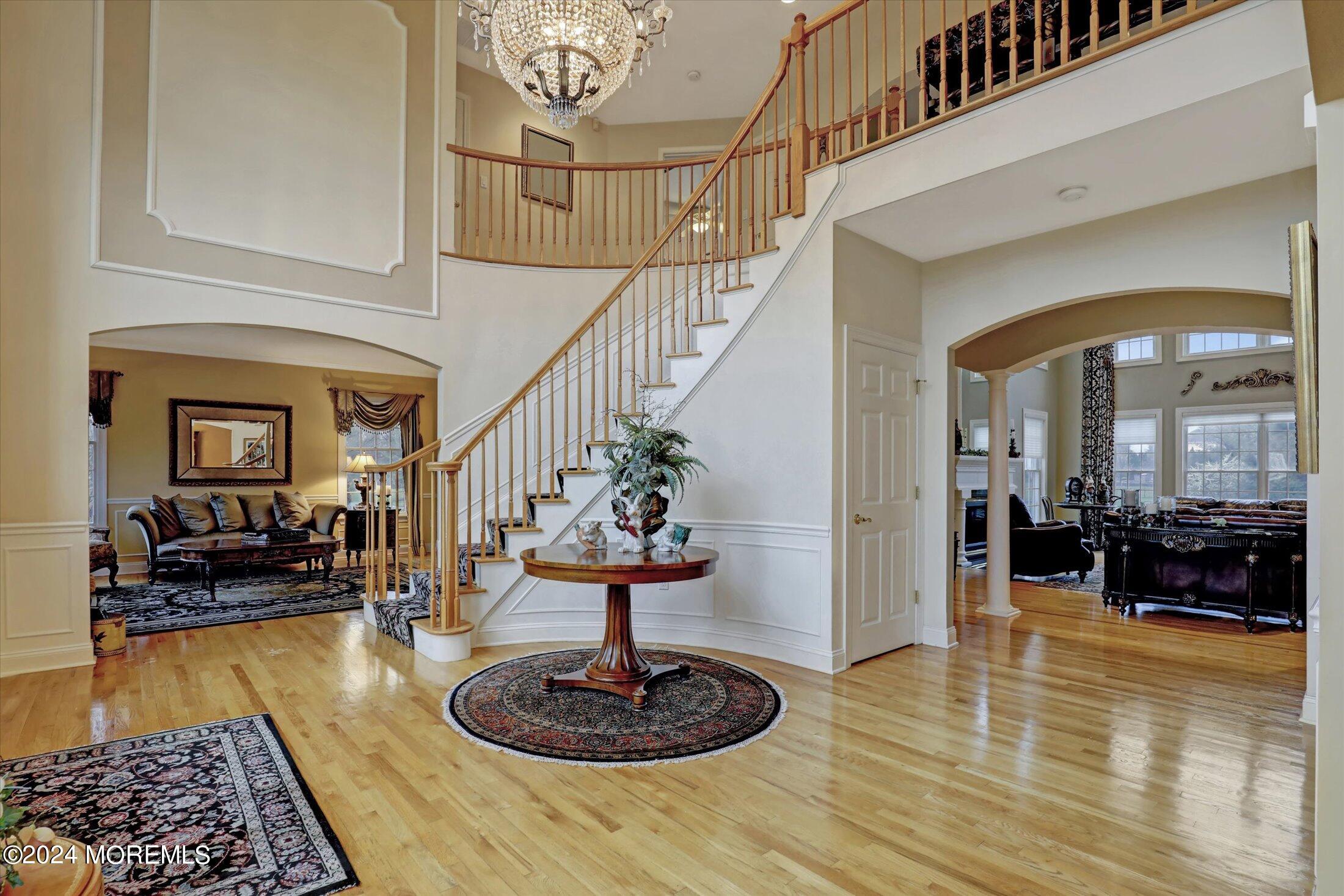 9 Shady Tree Lane Colts Neck, NJ 07722 - Photo 6 of 60 a lobby with furniture and wooden floor