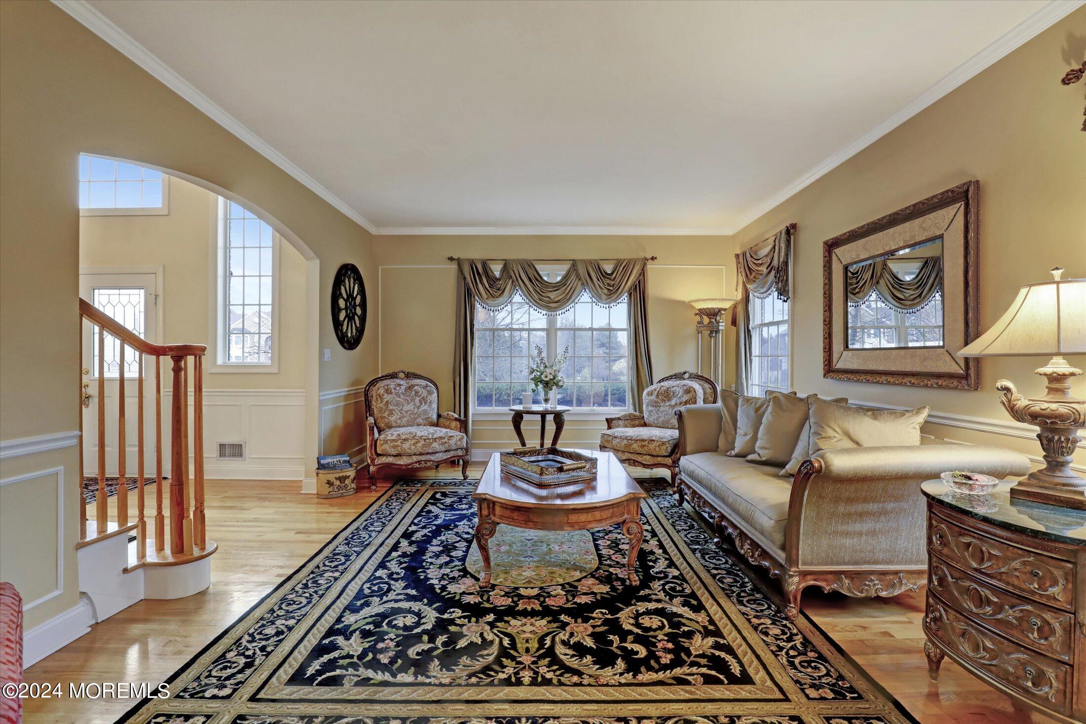 9 Shady Tree Lane Colts Neck, NJ 07722 - Photo 9 of 60 a living room with furniture a rug and a window