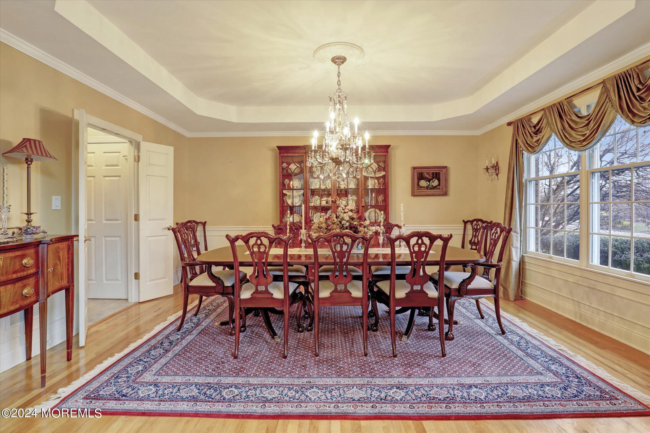 9 Shady Tree Lane Colts Neck, NJ 07722 - Photo 10 of 60 a view of a dining room with furniture window and wooden floor