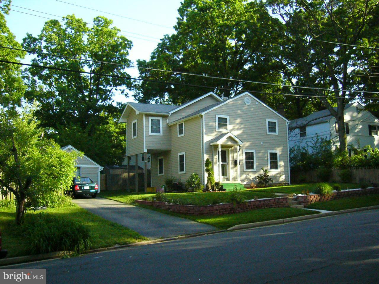 5112 11th Road South Arlington, VA 22204 - Photo 2 of 9 a front view of a house with a garden