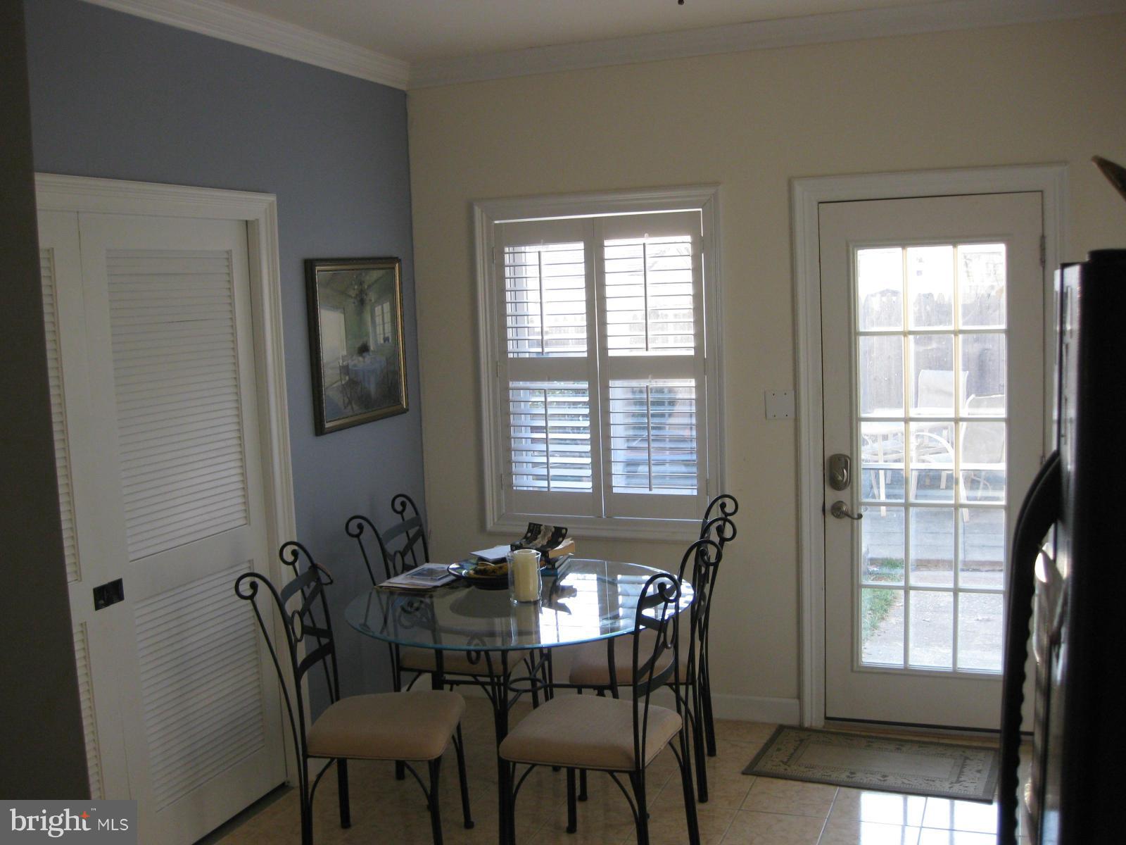 5112 11th Road South Arlington, VA 22204 - Photo 3 of 9 a view of a dining room with furniture and windows