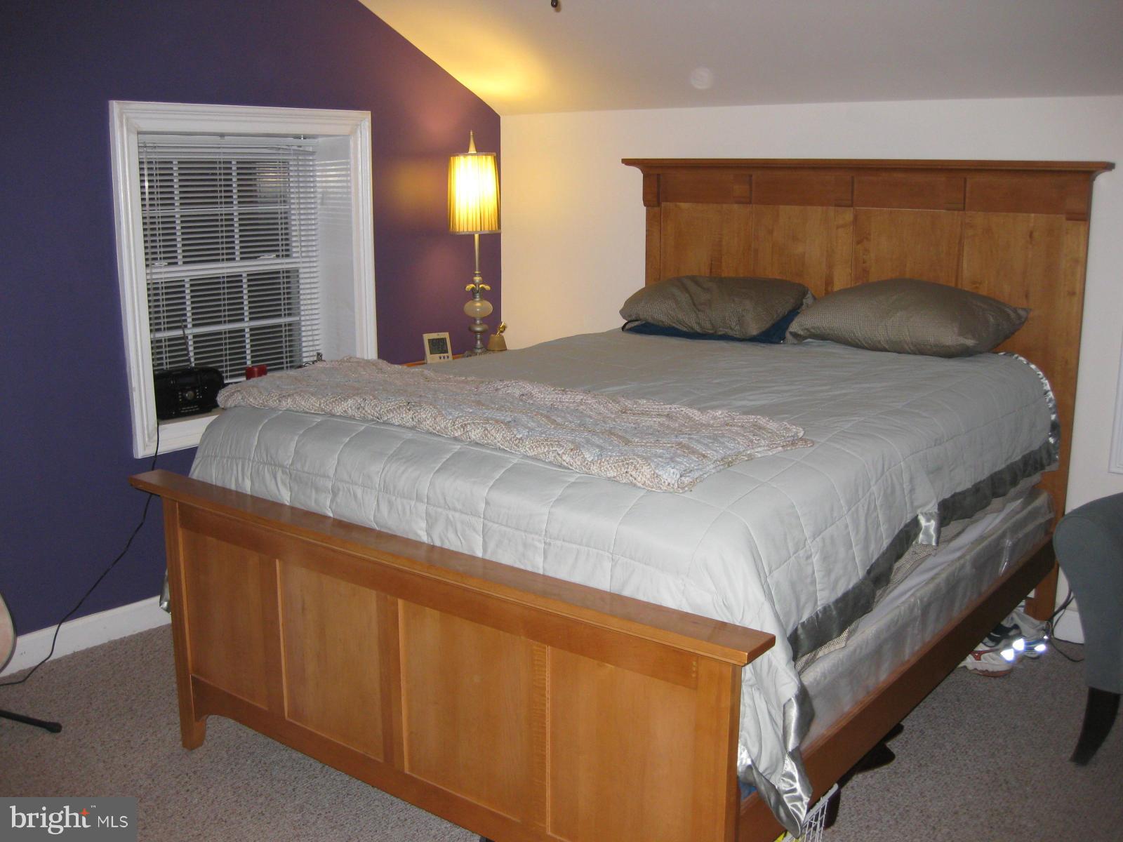 5112 11th Road South Arlington, VA 22204 - Photo 8 of 9 a bedroom with a bed and a window