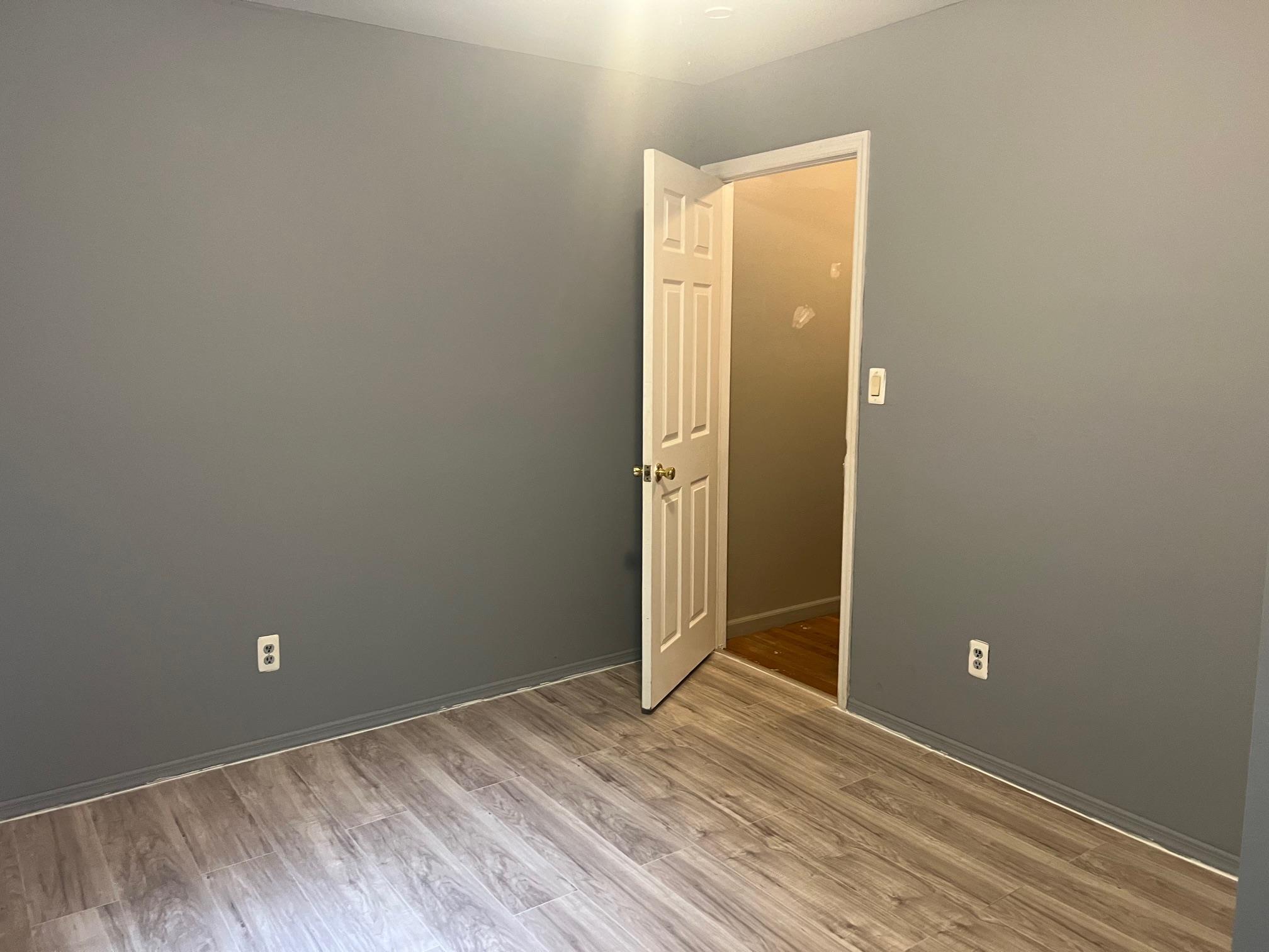 Empty room featuring light wood-style flooring and baseboards