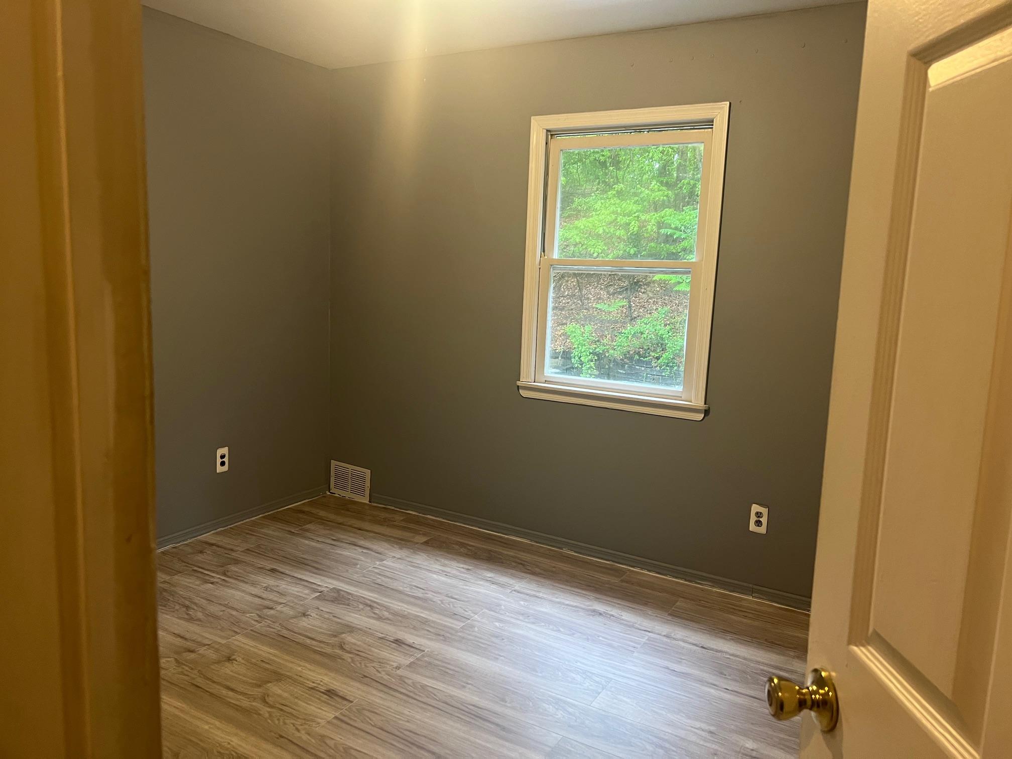 15 Old Field Road Setauket, NY 11733 - Photo 2 of 12 Unfurnished room featuring wood finished floors and baseboards