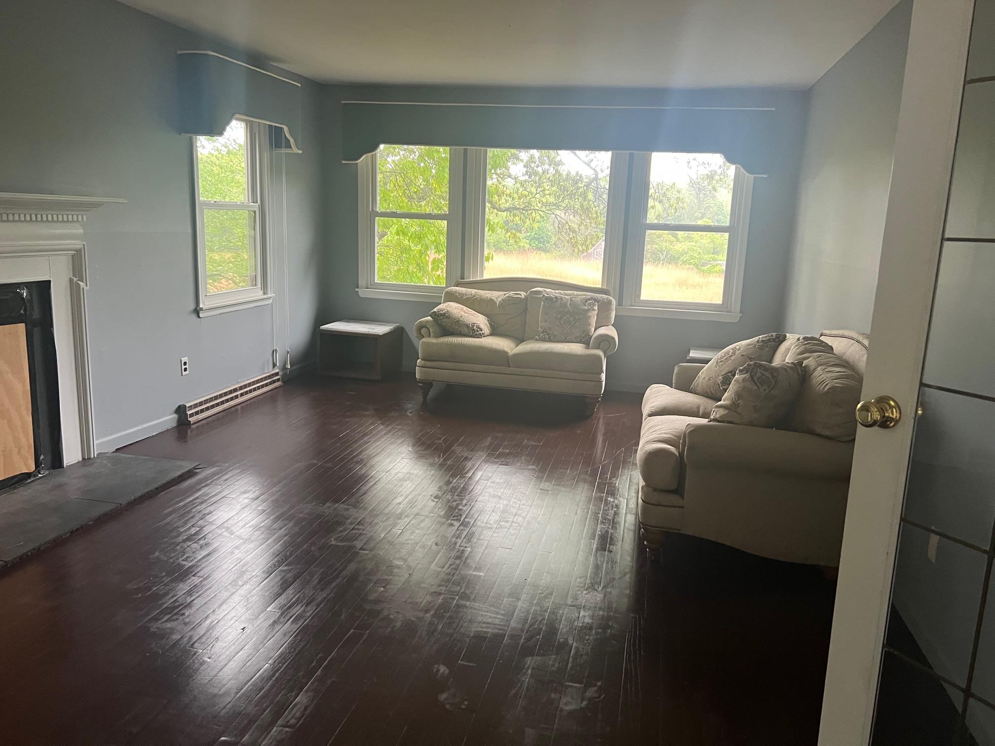 15 Old Field Road Setauket, NY 11733 - Photo 6 of 12 Living area featuring wood finished floors and a high end fireplace