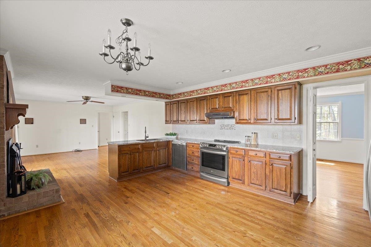140 Swisher Road Staunton, VA 24401 - Photo 15 of 53 a large kitchen with a wooden floor and cabinets