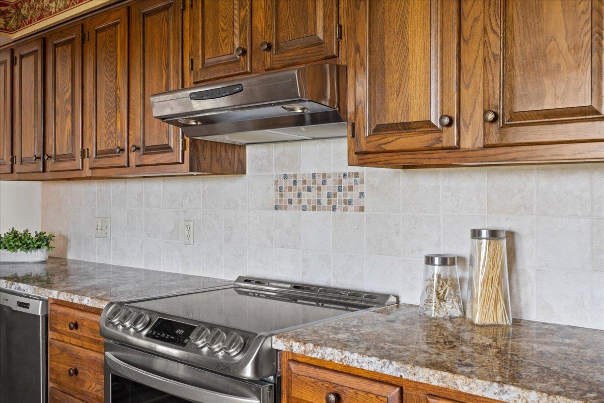 140 Swisher Road Staunton, VA 24401 - Photo 17 of 53 a kitchen with granite countertop a sink a stove and cabinets