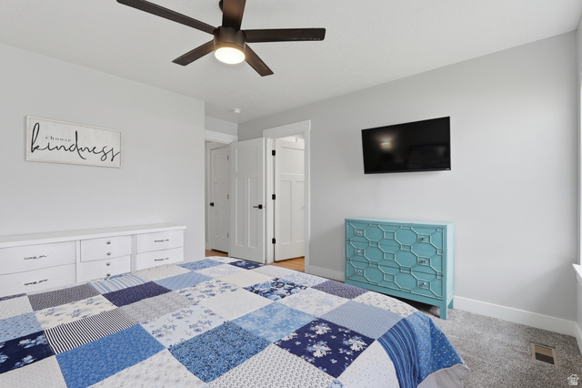 625 East 100 South Ephraim, UT 84627 - Photo 9 of 26 Bedroom featuring light gray walls, plush carpet flooring, a ceiling fan with integrated lighting, and white trim