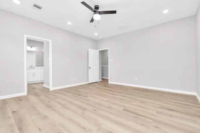 a bathroom with a sink vanity and a mirror