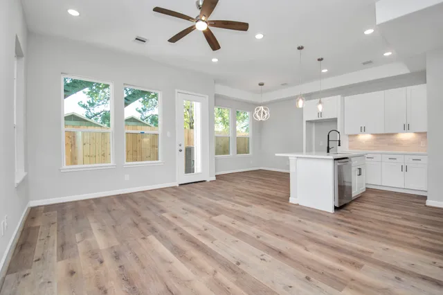 a view of kitchen with window and wooden floor