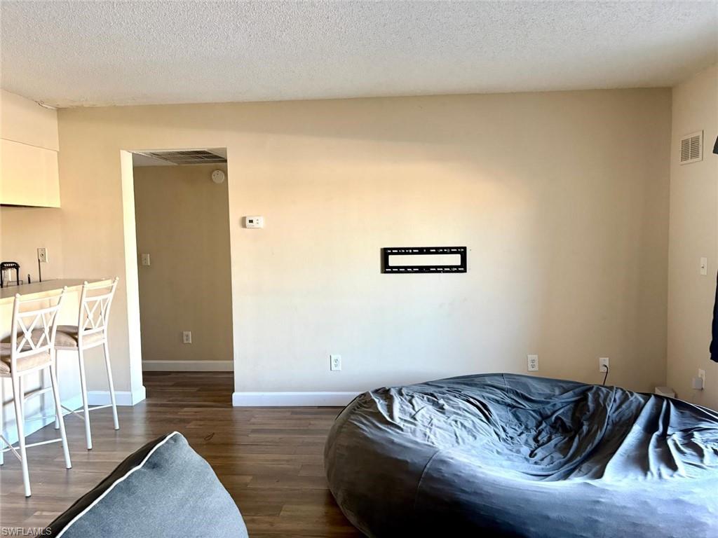 5315 Summerlin Road, Unit 1508 Fort Myers, FL 33919 - Photo 13 of 46 a bed sitting in a bedroom next to a window