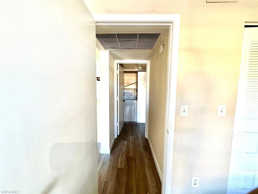 5315 Summerlin Road, Unit 1508 Fort Myers, FL 33919 - Photo 22 of 46 a view of a hallway with a wooden floor