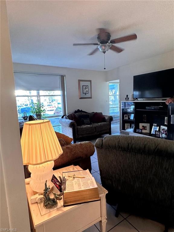 5315 Summerlin Road, Unit 1508 Fort Myers, FL 33919 - Photo 27 of 46 a living room with furniture and a flat screen tv