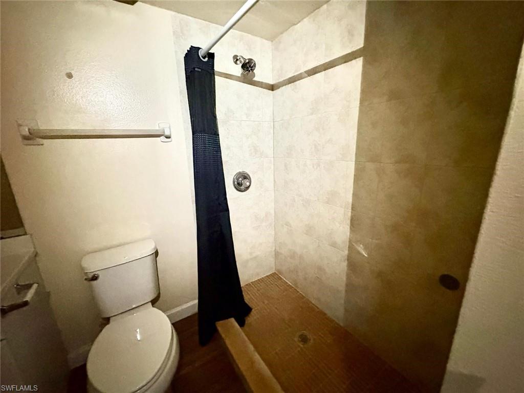 5315 Summerlin Road, Unit 1508 Fort Myers, FL 33919 - Photo 30 of 46 a bathroom with a toilet and a shower