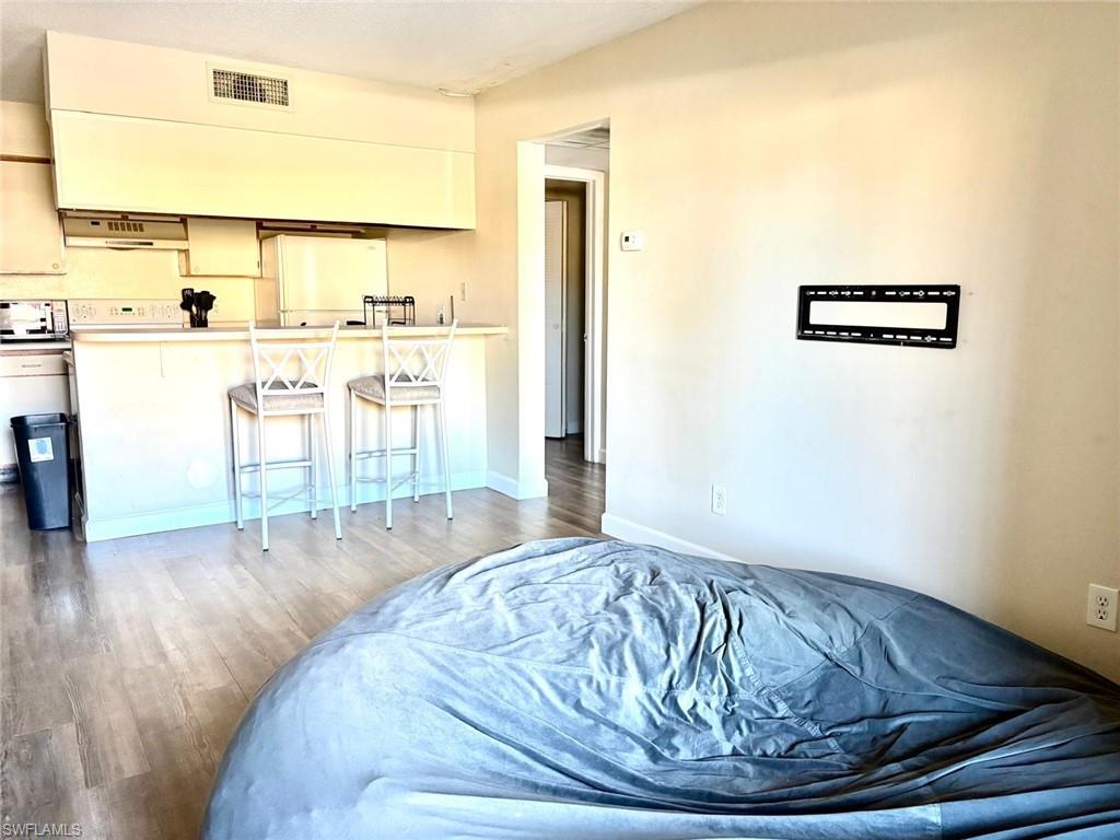 5315 Summerlin Road, Unit 1508 Fort Myers, FL 33919 - Photo 40 of 46 a view of a living room with wooden floor