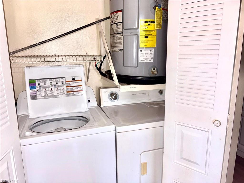 5315 Summerlin Road, Unit 1508 Fort Myers, FL 33919 - Photo 43 of 46 a utility room with a window dryer and washer