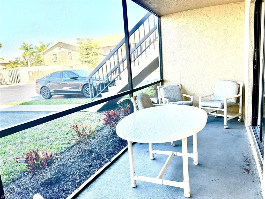 5315 Summerlin Road, Unit 1508 Fort Myers, FL 33919 - Photo 6 of 46 a view of a chairs and table in the patio