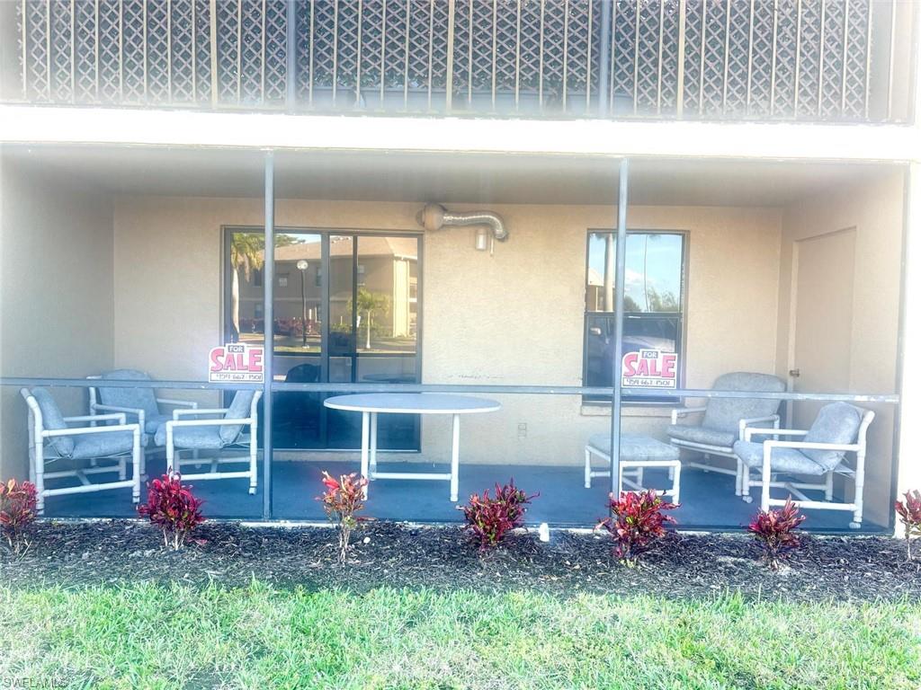 5315 Summerlin Road, Unit 1508 Fort Myers, FL 33919 - Photo 7 of 46 a view of front door and fire pit