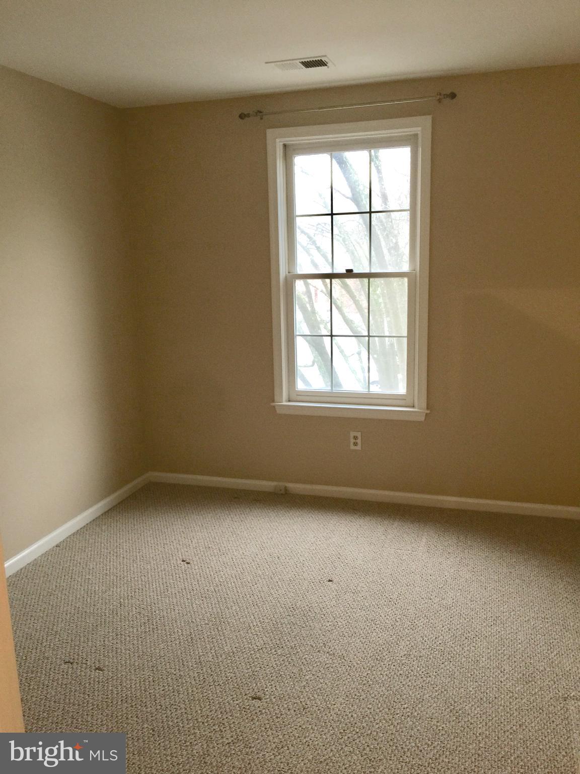 10715 Kings Riding Way, Unit 202 North Bethesda, MD 20852 - Photo 13 of 17 an empty room with a window