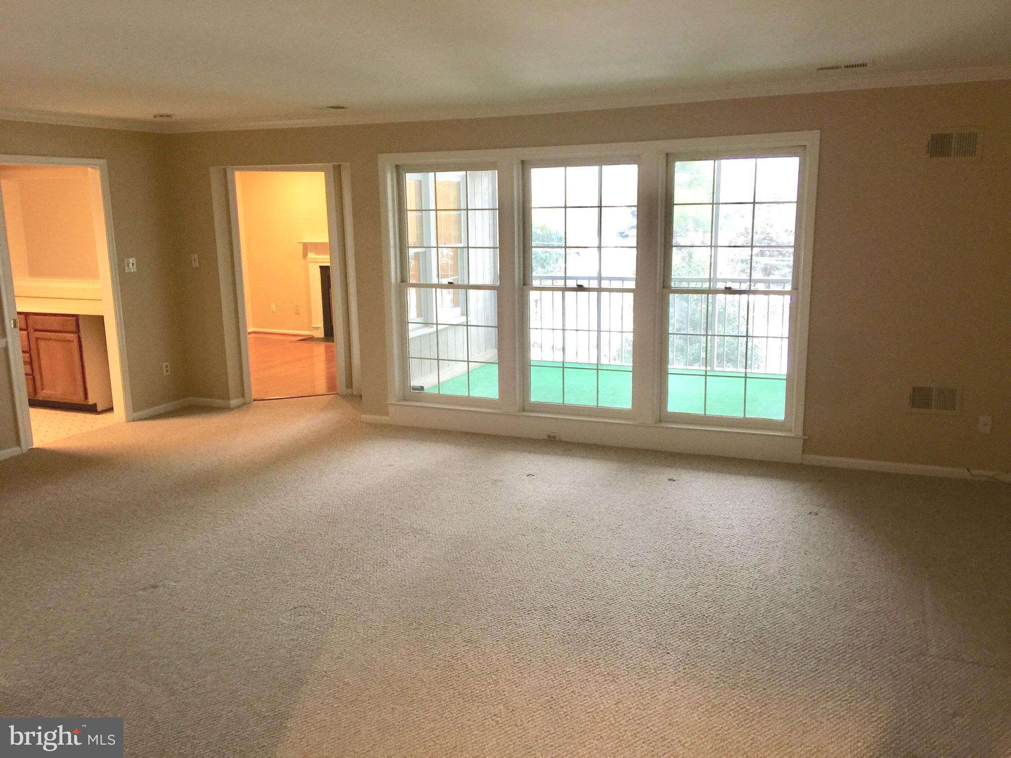 10715 Kings Riding Way, Unit 202 North Bethesda, MD 20852 - Photo 5 of 17 an empty room with windows