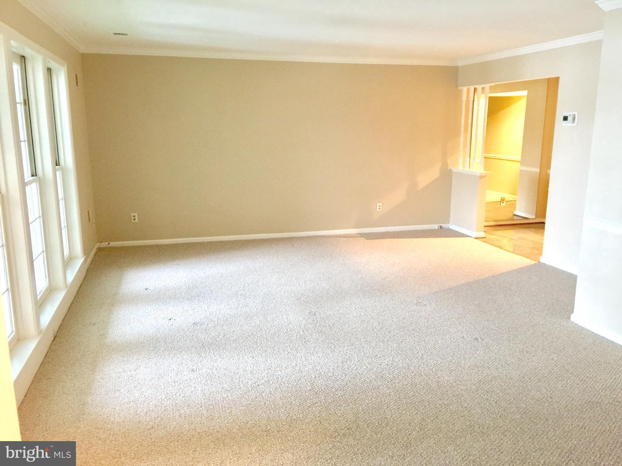 10715 Kings Riding Way, Unit 202 North Bethesda, MD 20852 - Photo 6 of 17 a view of an empty room and window