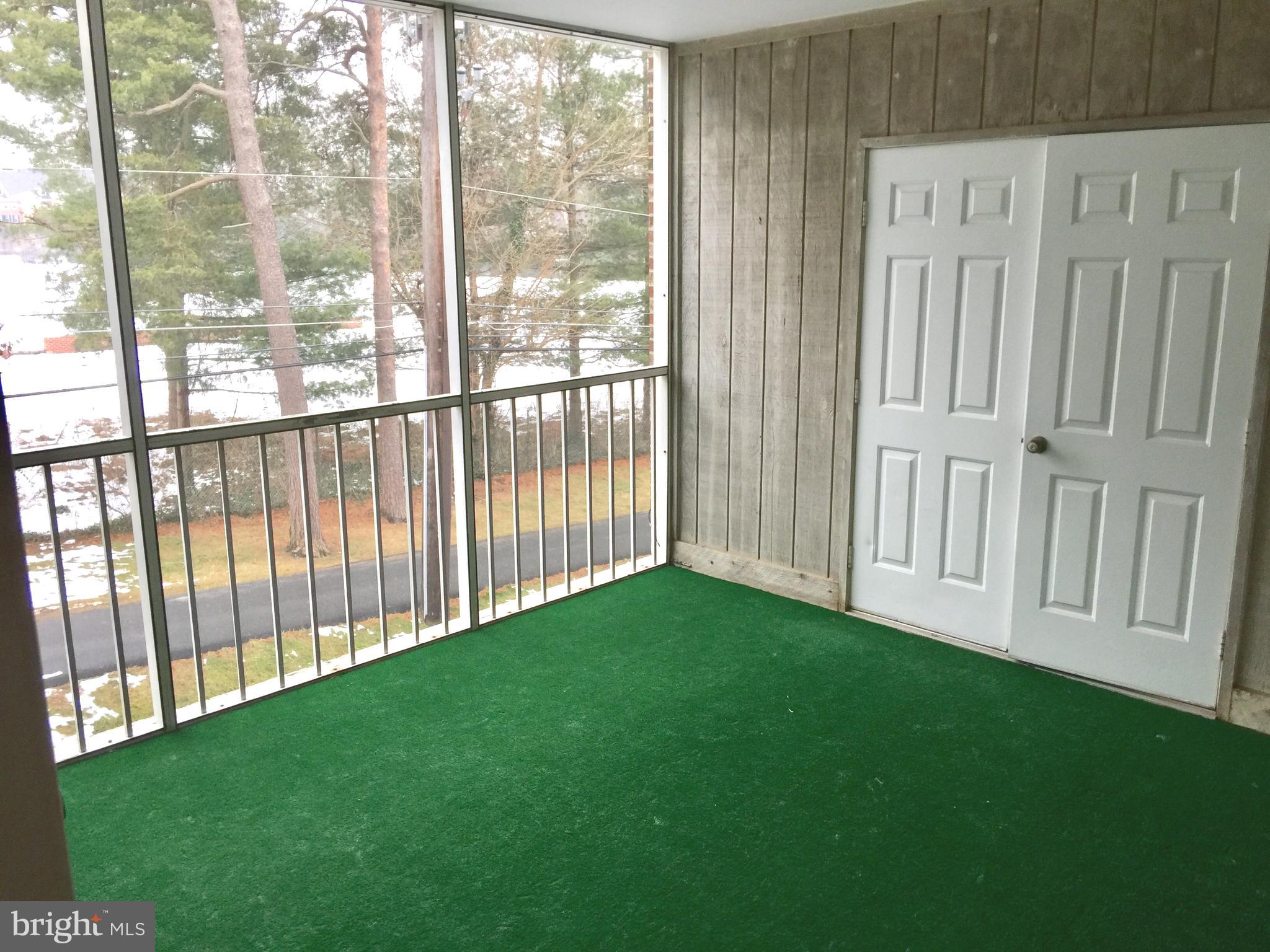 10715 Kings Riding Way, Unit 202 North Bethesda, MD 20852 - Photo 9 of 17 a view of a porch with a yard