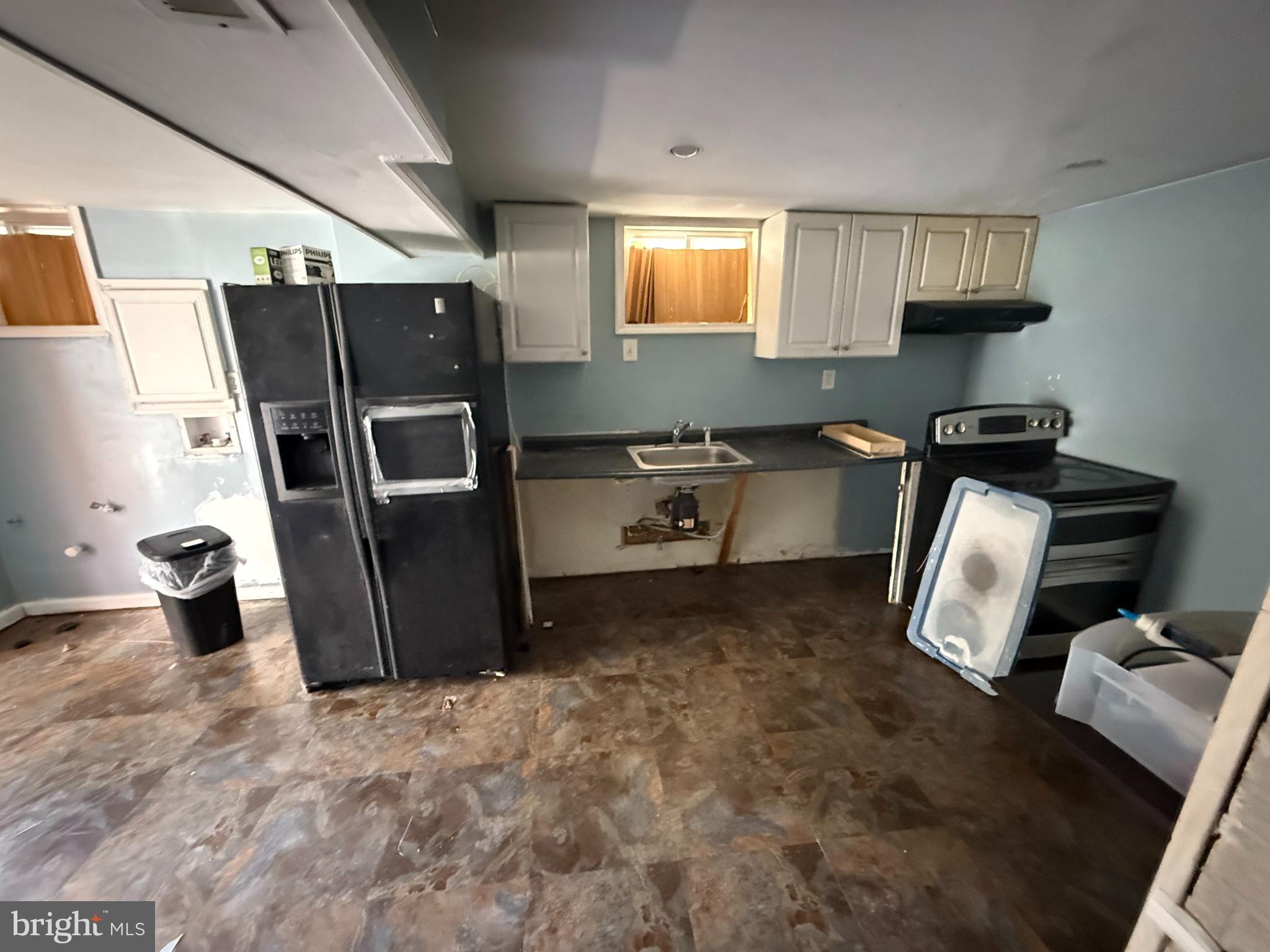 7003 Fairwood Road Hyattsville, MD 20784 - Photo 11 of 30 a kitchen with stainless steel appliances granite countertop a refrigerator stove and sink