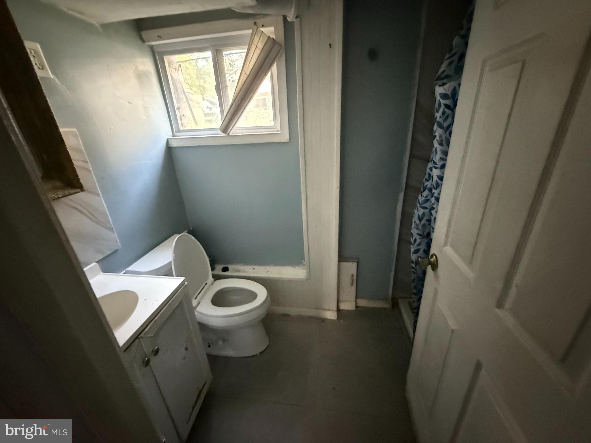 7003 Fairwood Road Hyattsville, MD 20784 - Photo 12 of 30 a white toilet sitting next to a window