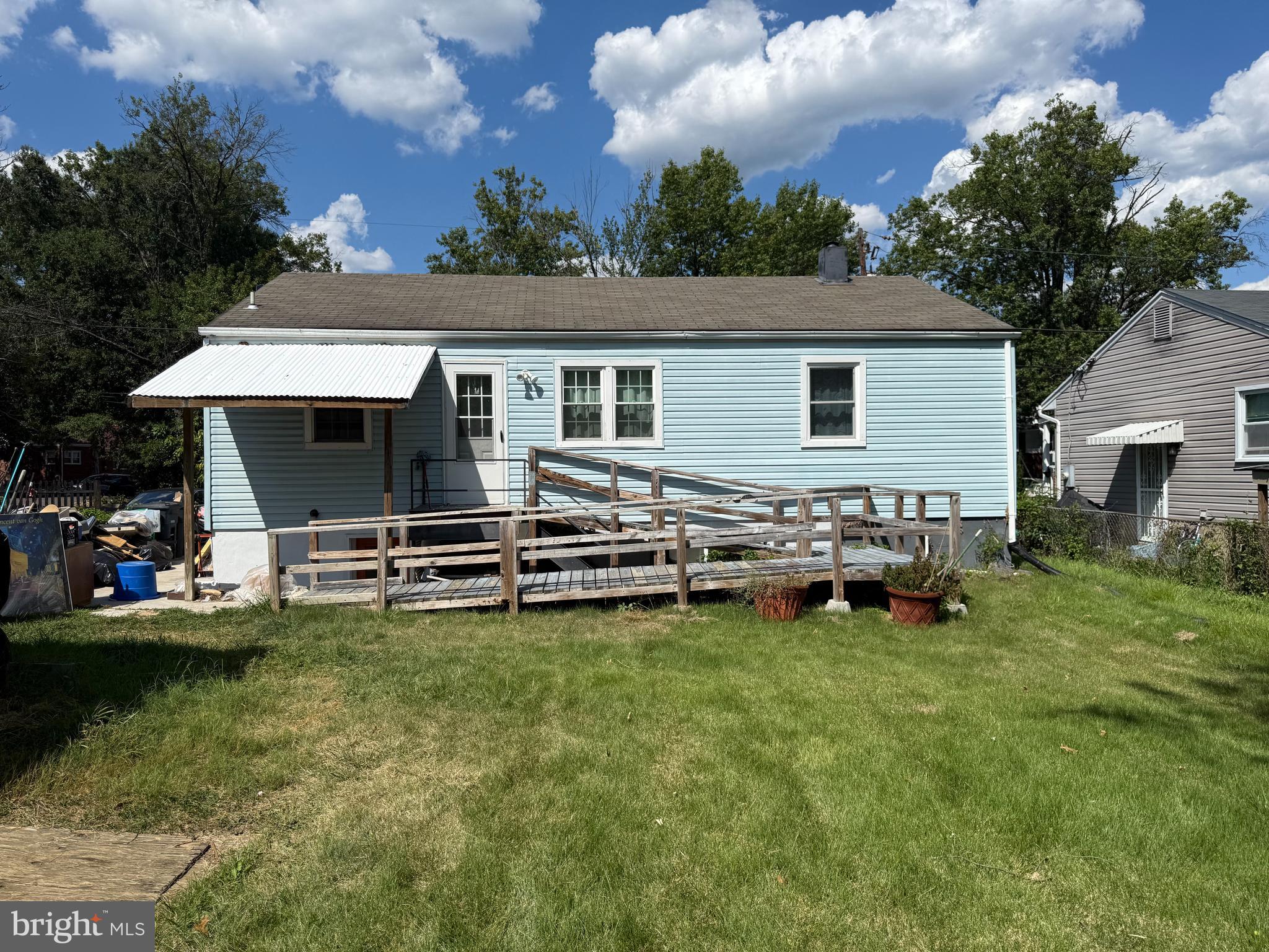 7003 Fairwood Road Hyattsville, MD 20784 - Photo 17 of 30 a view of a house with swimming pool and sitting area
