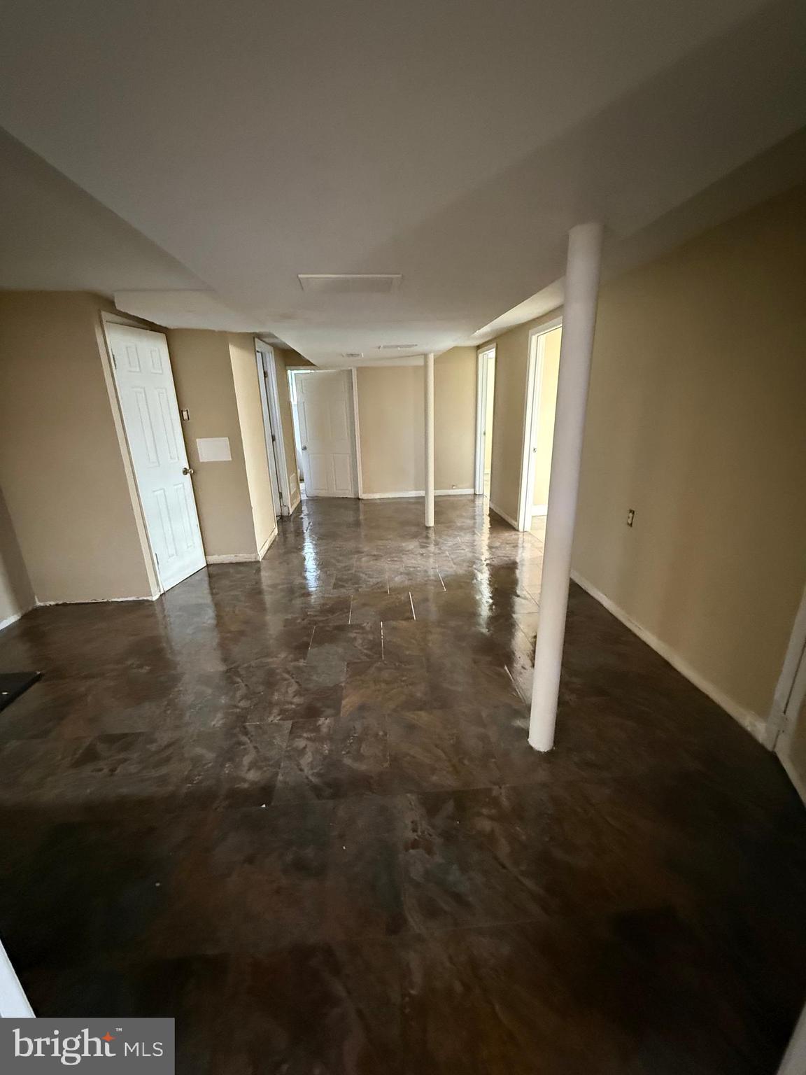 7003 Fairwood Road Hyattsville, MD 20784 - Photo 19 of 30 a view of an empty room with wooden floor and a window
