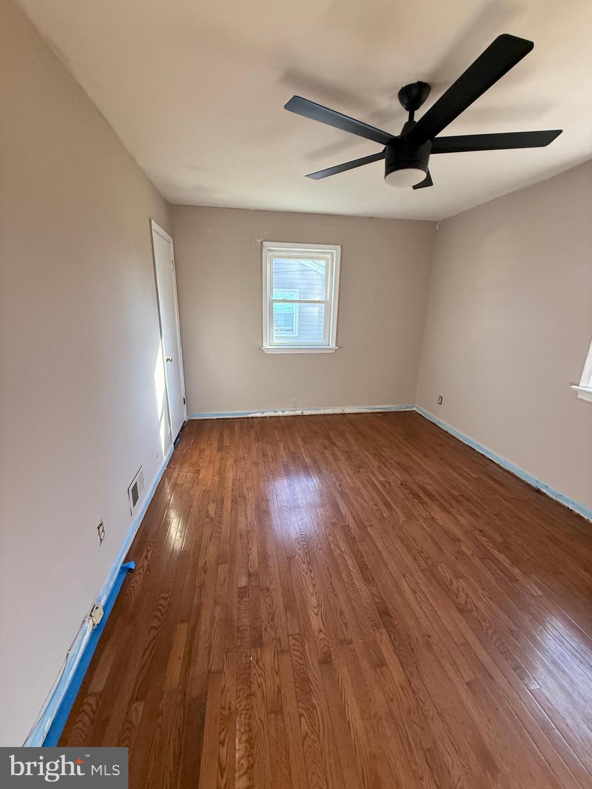 7003 Fairwood Road Hyattsville, MD 20784 - Photo 22 of 30 a view of empty room with wooden floor