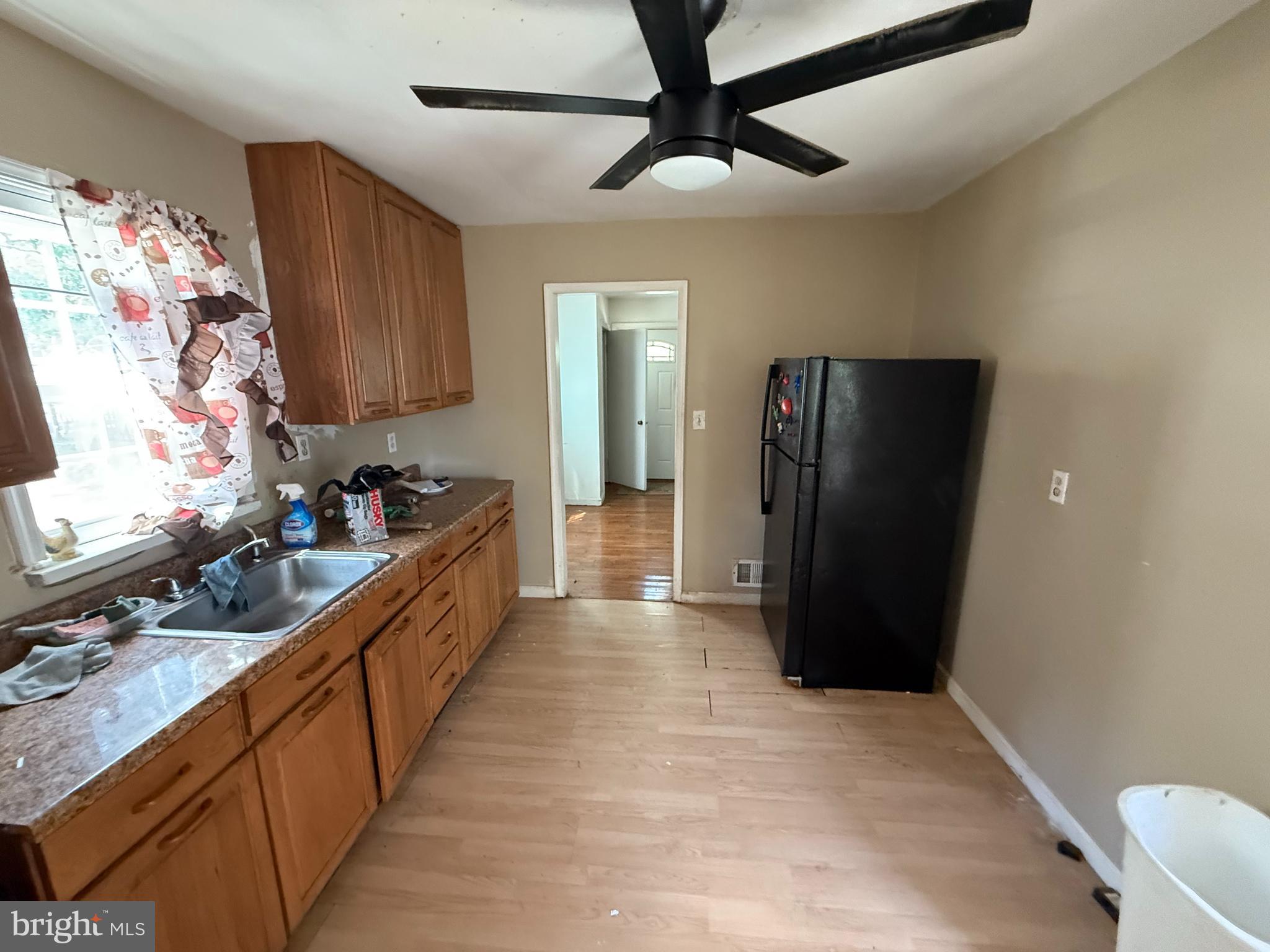 7003 Fairwood Road Hyattsville, MD 20784 - Photo 6 of 30 a kitchen with stainless steel appliances a refrigerator and a sink