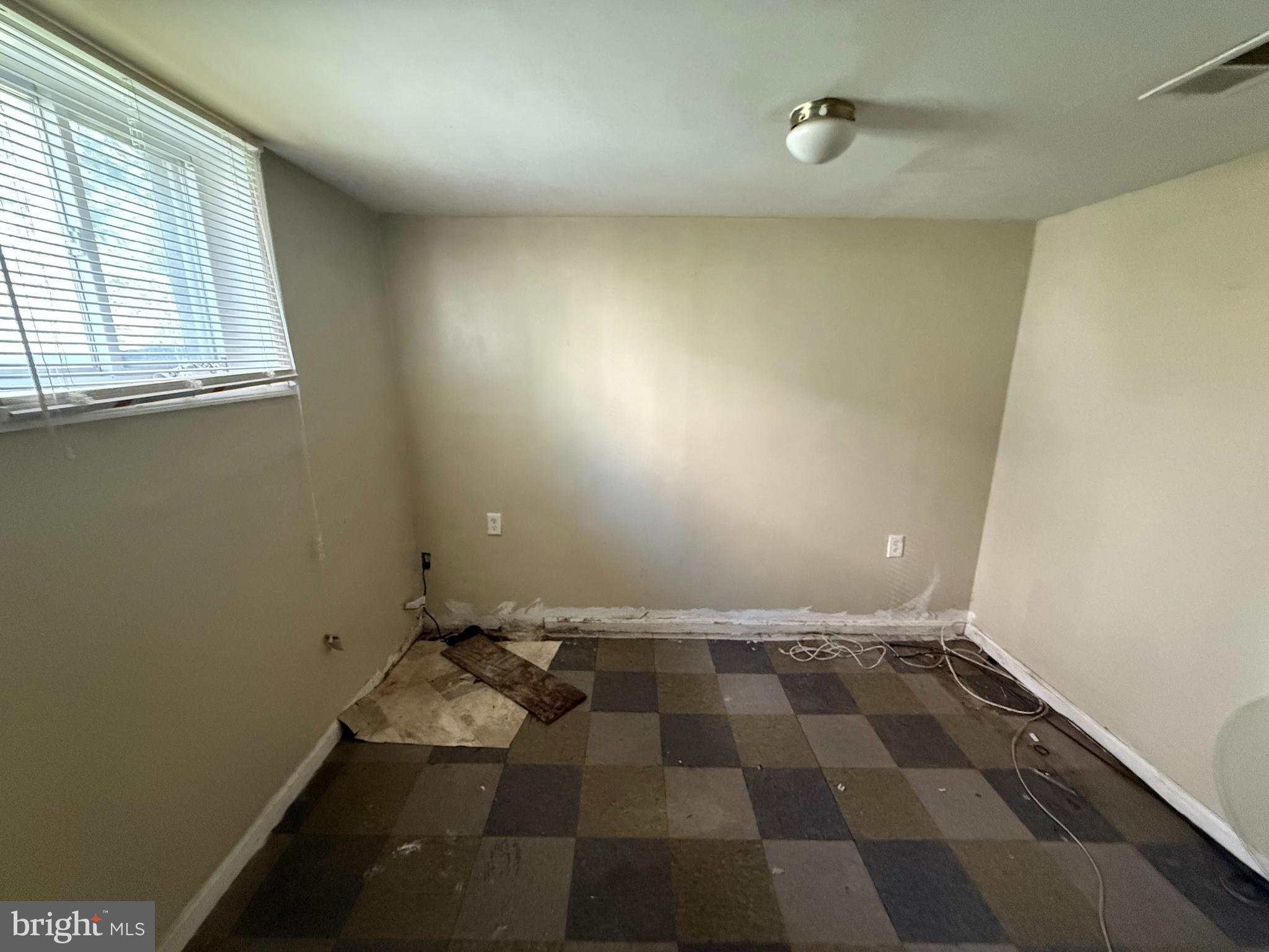 7003 Fairwood Road Hyattsville, MD 20784 - Photo 8 of 30 an empty room with wooden floor