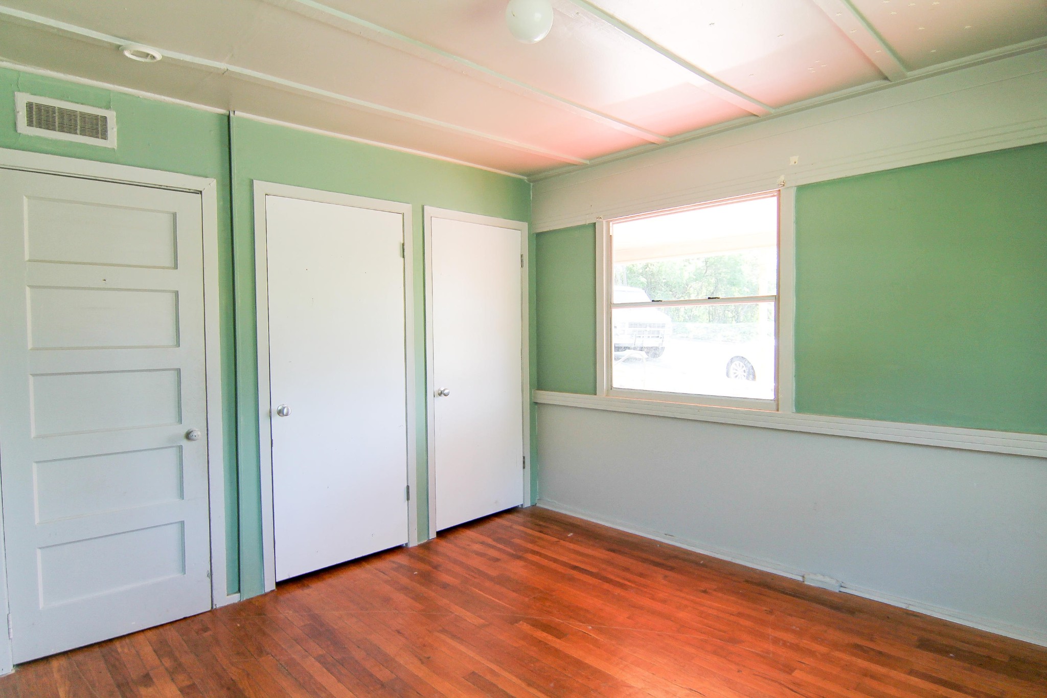 100 East Damascus Road Oak Ridge, TN 37830 - Photo 11 of 16 an empty room with wooden floor and windows