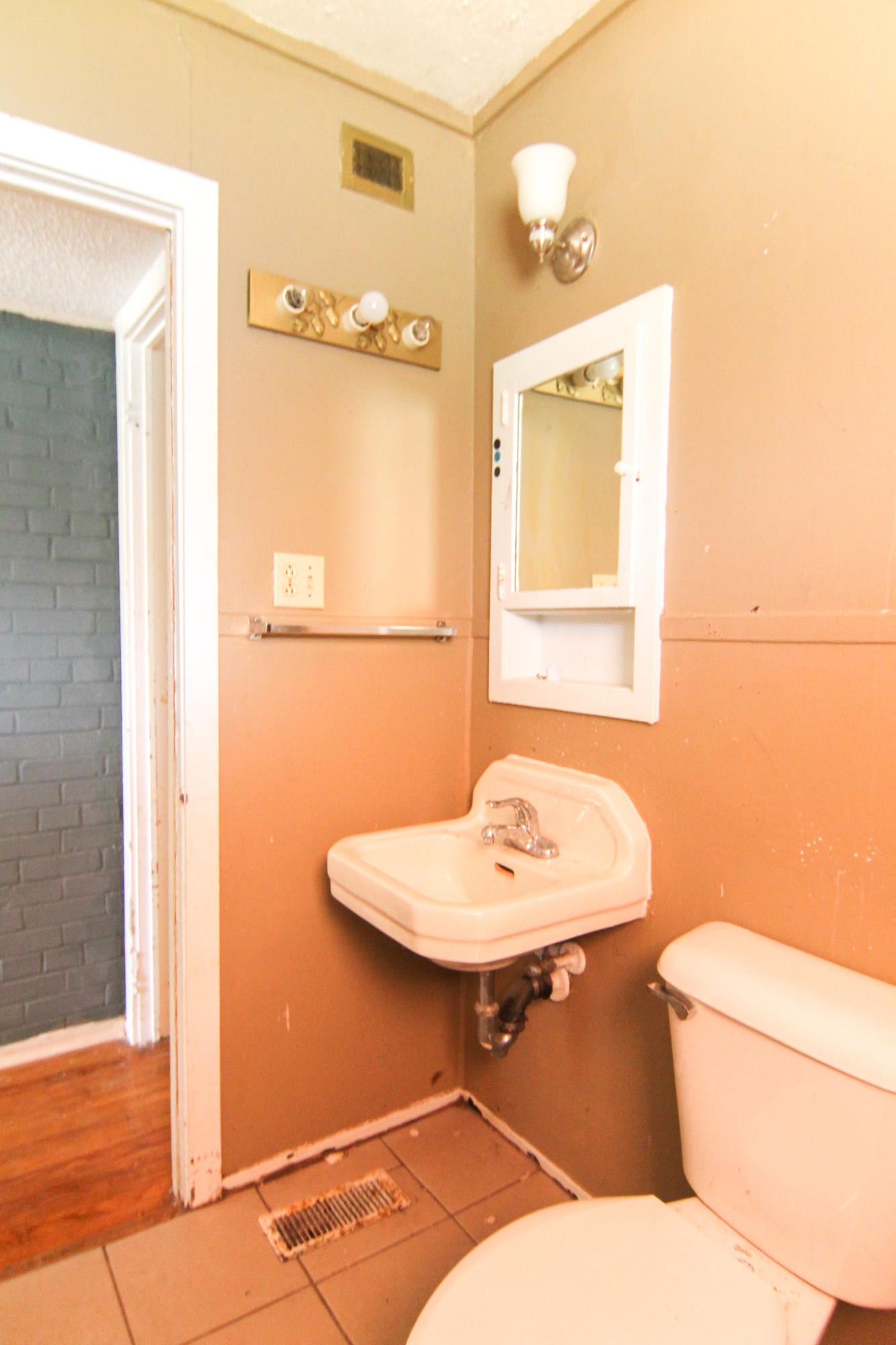 100 East Damascus Road Oak Ridge, TN 37830 - Photo 14 of 16 a bathroom with a sink mirror vanity and toilet