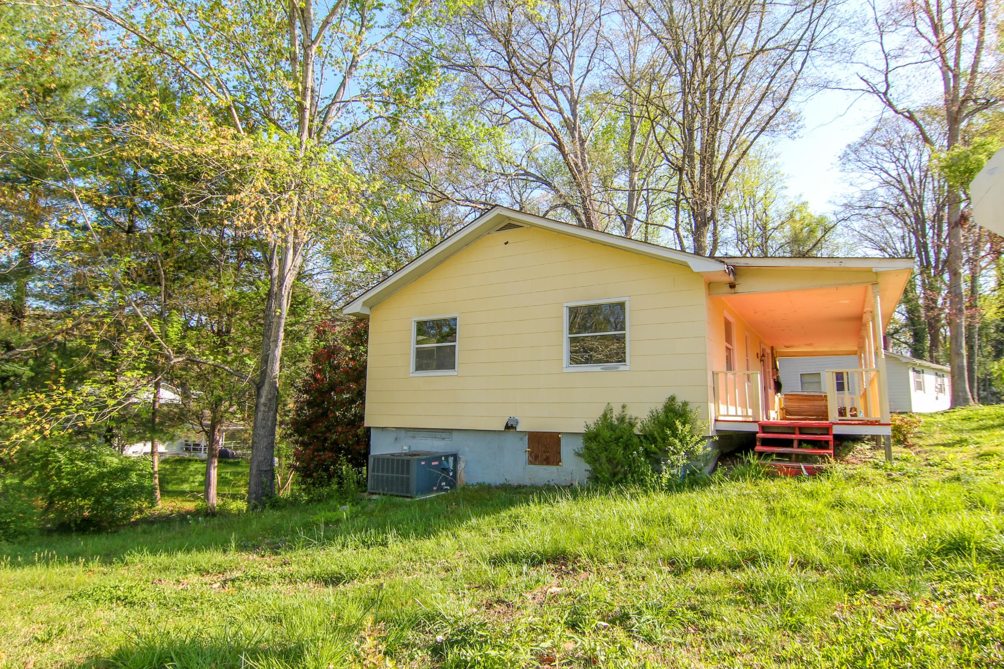 100 East Damascus Road Oak Ridge, TN 37830 - Photo 2 of 16 a backyard of a house with garden and trees