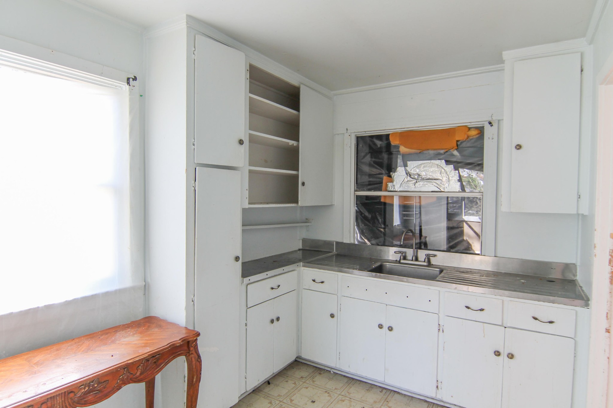 100 East Damascus Road Oak Ridge, TN 37830 - Photo 8 of 16 a kitchen with cabinets and window