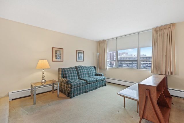 8809 West Golf Road, Unit 2B Niles, IL 60714 - Photo 13 of 17 a living room with furniture and a window