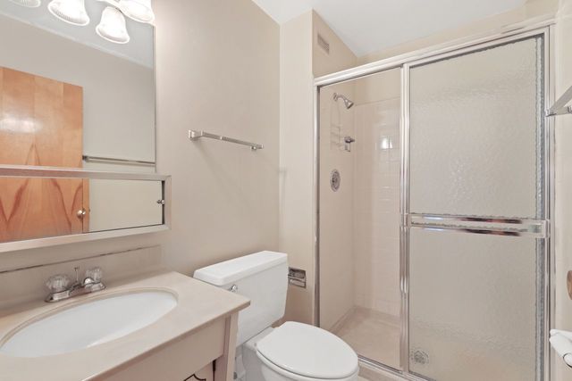 8809 West Golf Road, Unit 2B Niles, IL 60714 - Photo 14 of 17 a bathroom with a sink toilet and shower
