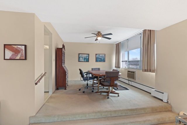 8809 West Golf Road, Unit 2B Niles, IL 60714 - Photo 4 of 17 a living room with furniture and window
