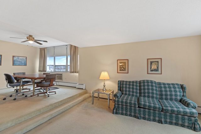 8809 West Golf Road, Unit 2B Niles, IL 60714 - Photo 9 of 17 a living room with furniture