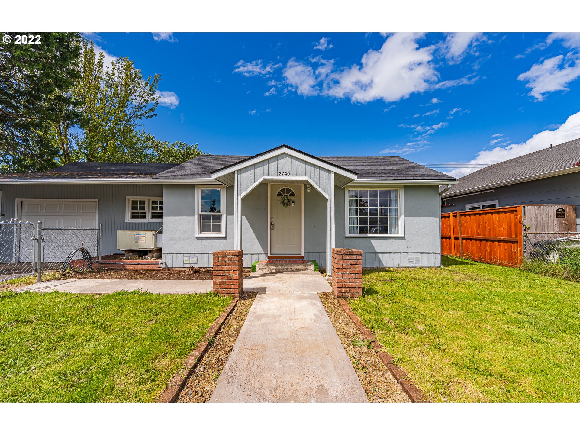 2740 D Street Springfield, OR 97477 - Photo 1 of 21 a front view of a house with swimming pool having outdoor seating