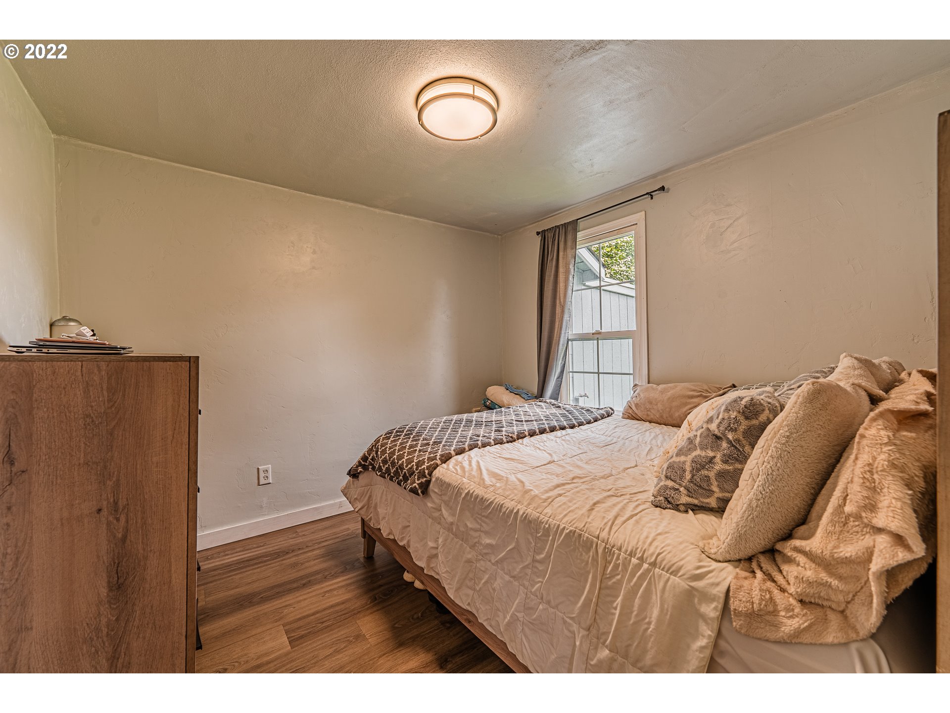 2740 D Street Springfield, OR 97477 - Photo 13 of 21 a bedroom with a bed and a night stand