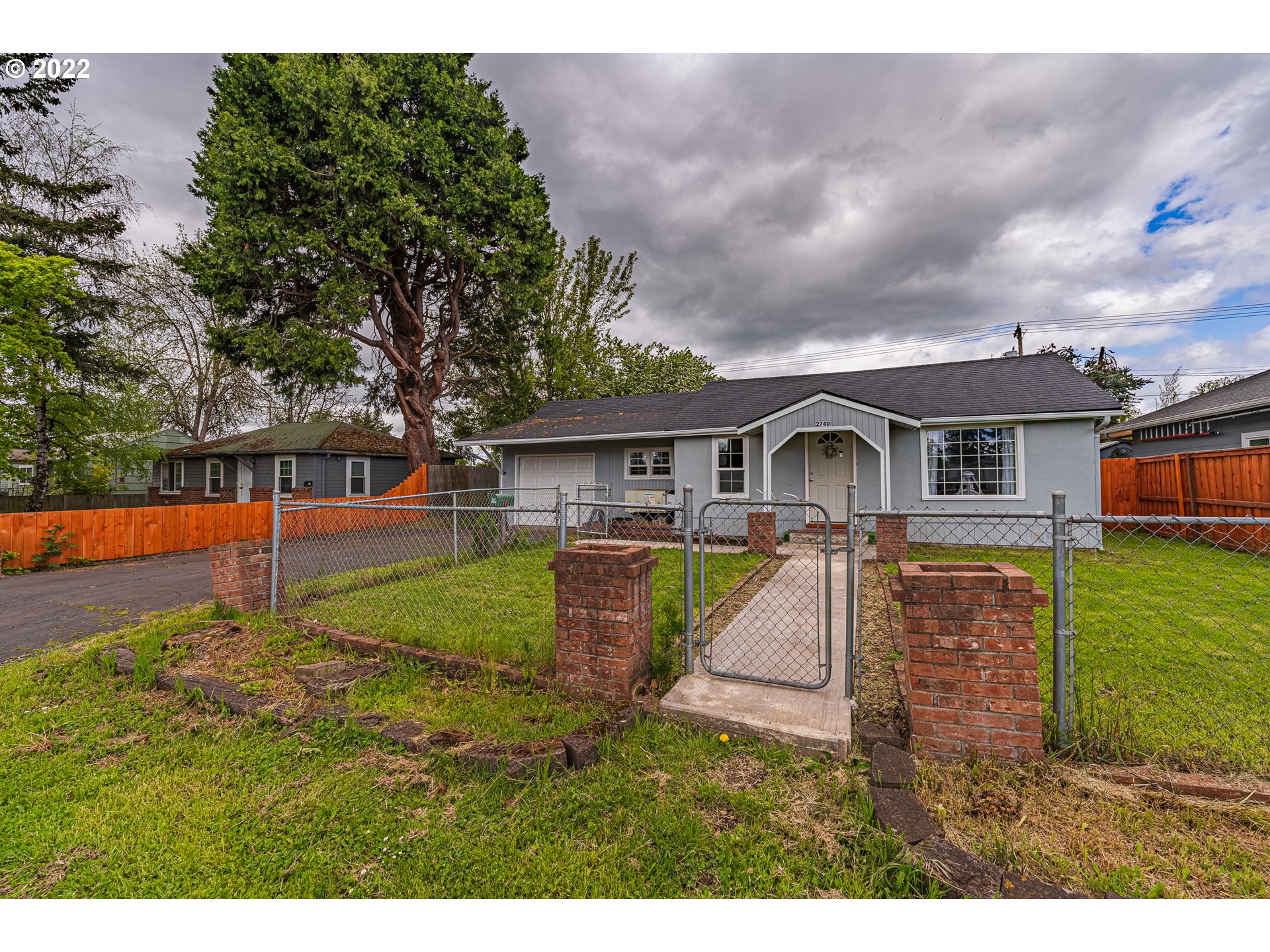 2740 D Street Springfield, OR 97477 - Photo 2 of 21 a front view of house with yard and green space