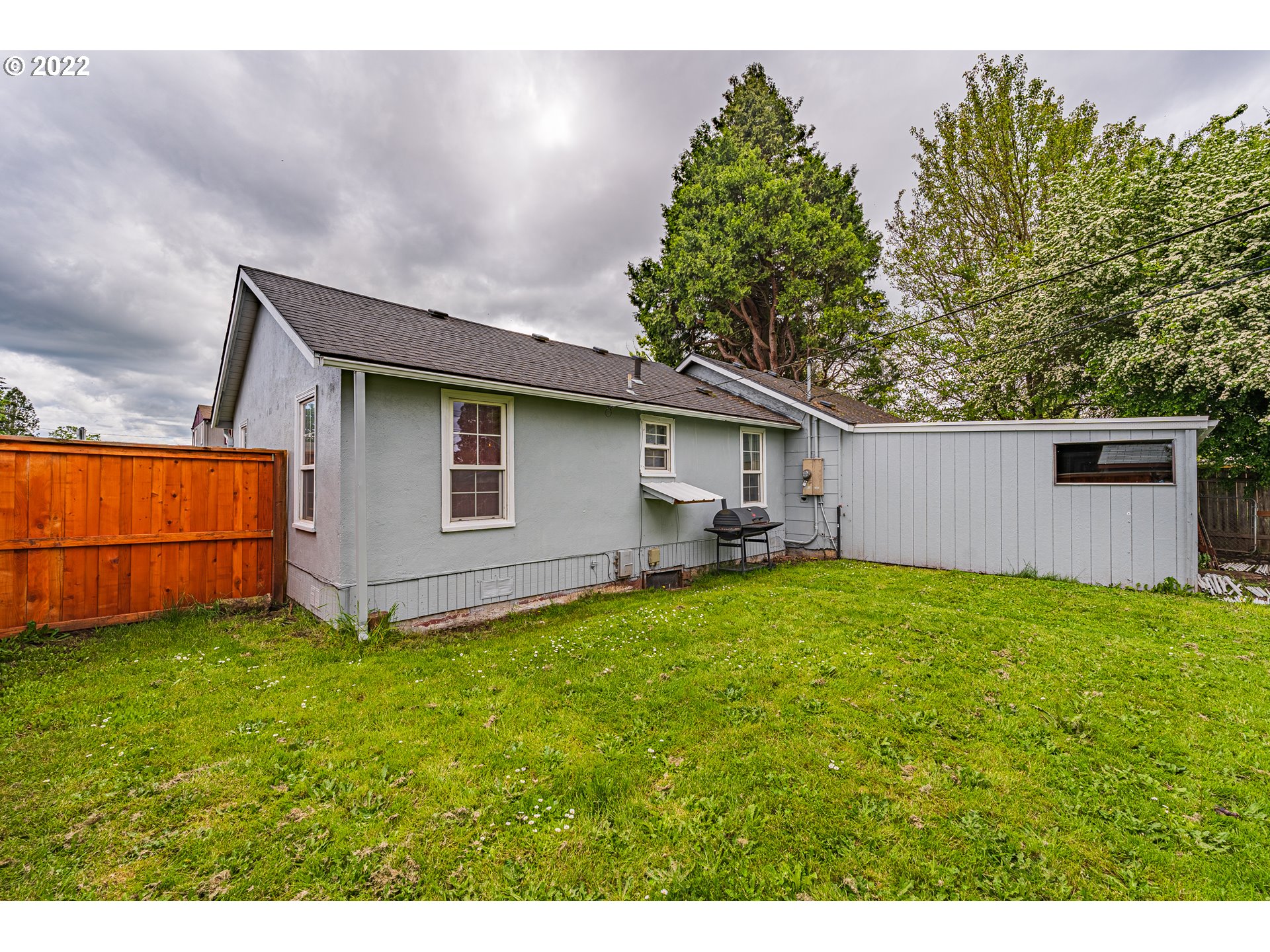 2740 D Street Springfield, OR 97477 - Photo 21 of 21 a backyard of a house with lots of green space