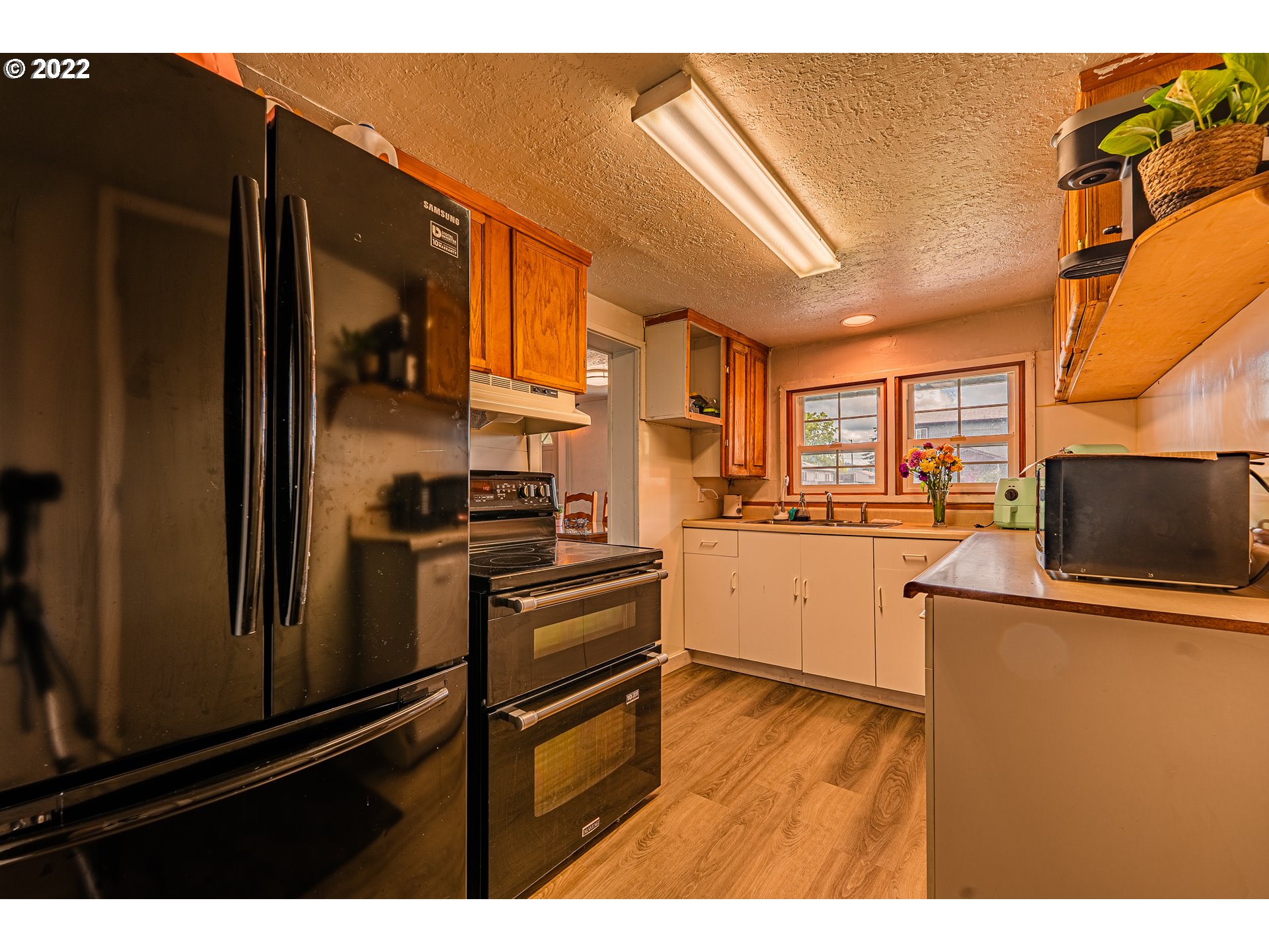 2740 D Street Springfield, OR 97477 - Photo 9 of 21 a kitchen view with a sink stainless steel appliances and cabinets