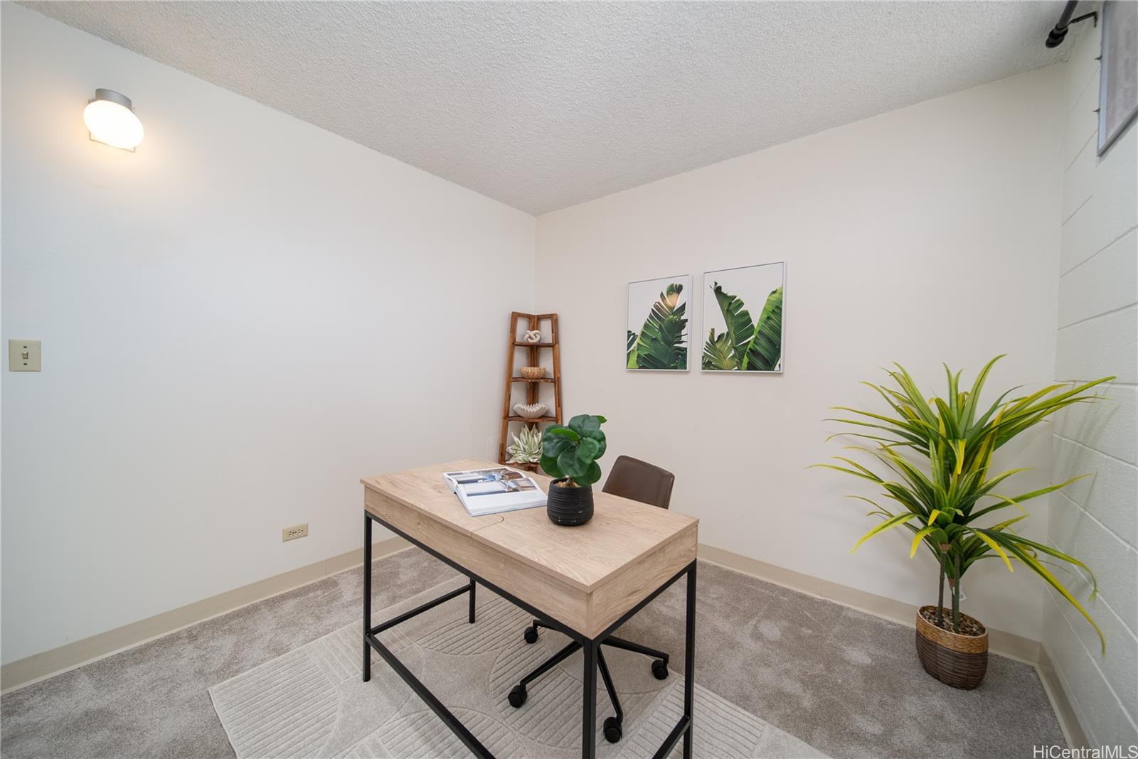 3030 Ala Ilima Street, Unit 907 Honolulu, HI 96818 - Photo 17 of 25 a view of a workspace with a table and chair
