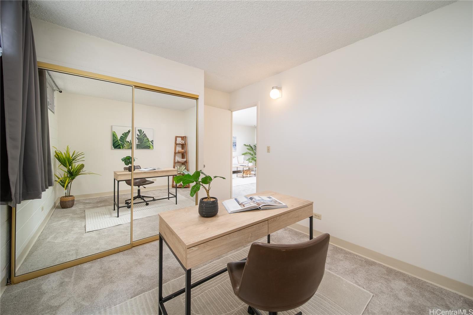 3030 Ala Ilima Street, Unit 907 Honolulu, HI 96818 - Photo 19 of 25 a living room with furniture and a potted plant