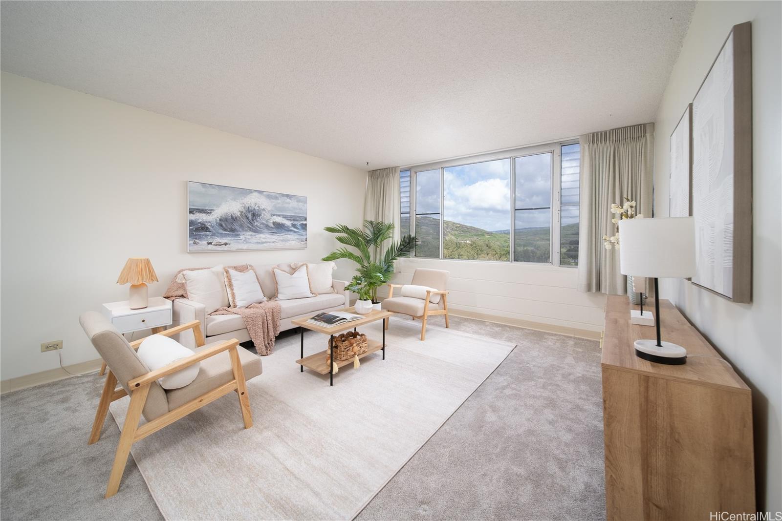 3030 Ala Ilima Street, Unit 907 Honolulu, HI 96818 - Photo 4 of 25 a living room with furniture and a large window