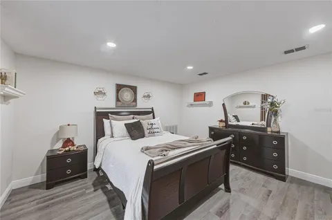 a bedroom with furniture and a window